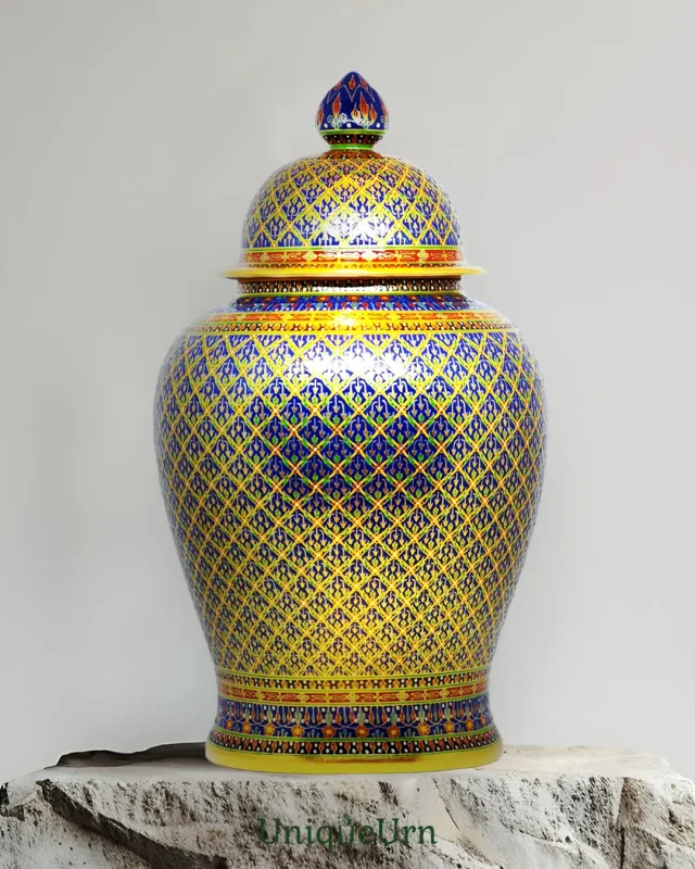 The Gold and dark blue handcrafted Bencharong companion Urns for ashes in Thoplue jinger jar shape by UniqueUrn