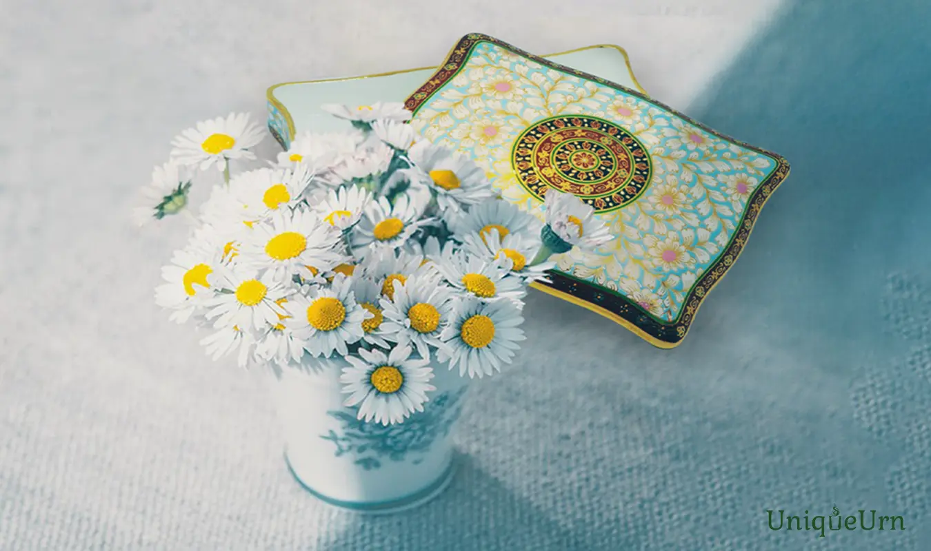Exquisite Bencharong art rectangle Bone China keepsake urn for ashes in pastel blue & pink with gold Chakri pattern representing modern memorial art.