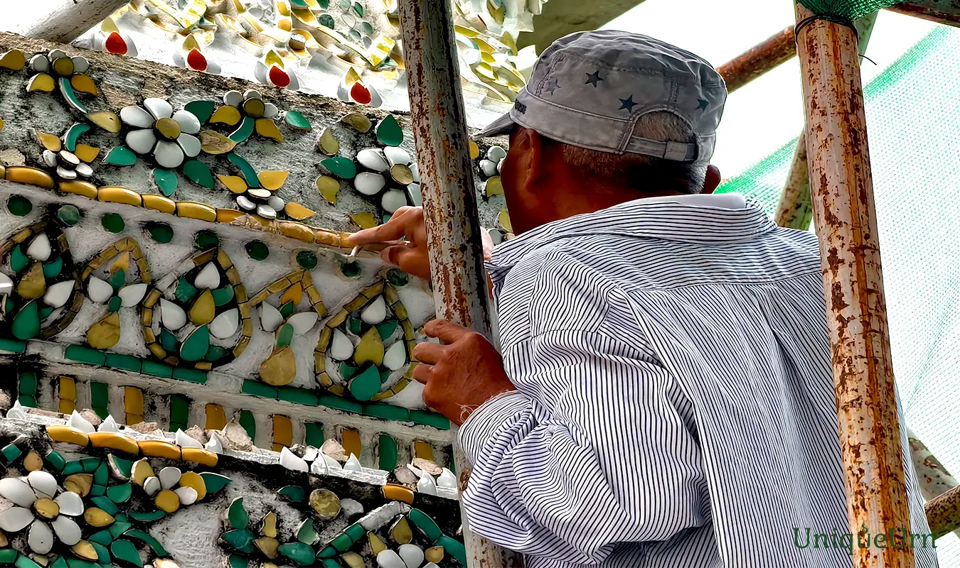 Technicians are repairing and decorating the tiles at the Wat Pho’s stupa to maintain them beautifully and permanently.