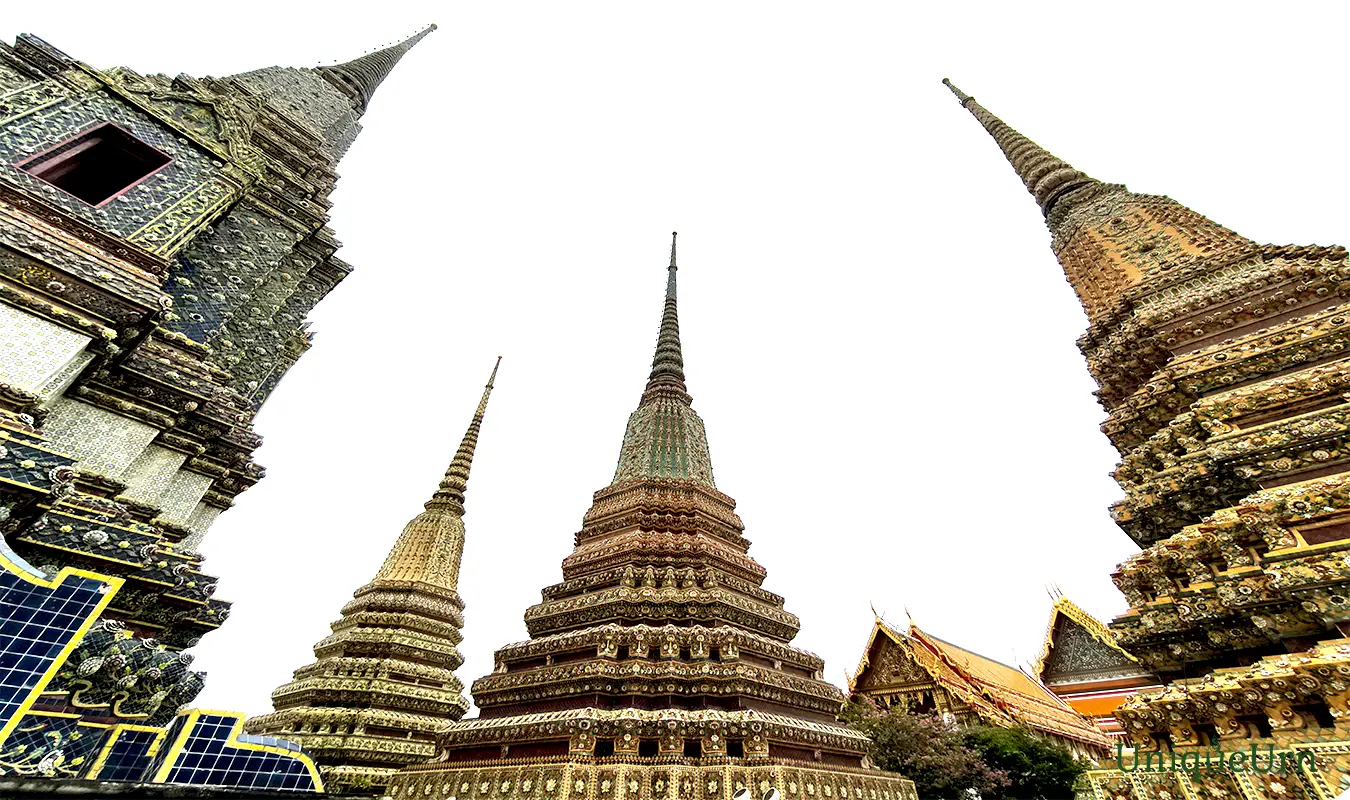 Meticulous porcelain floral ornamentation on the Great Stupas of Wat Pho represents a fusion of Thai and Chinese art styles - memorial arts as UniqueUrn.