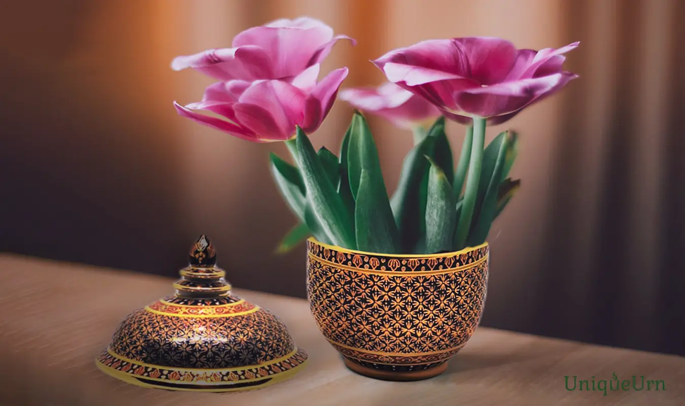 The Miracle of Being Awake: Transforming Loss into Peace, as Tulip flowers and the art of a masterpiece hand-painted Thai Benjarong art Thochan memorial keepsake urn for ashes from UniqueUrn.