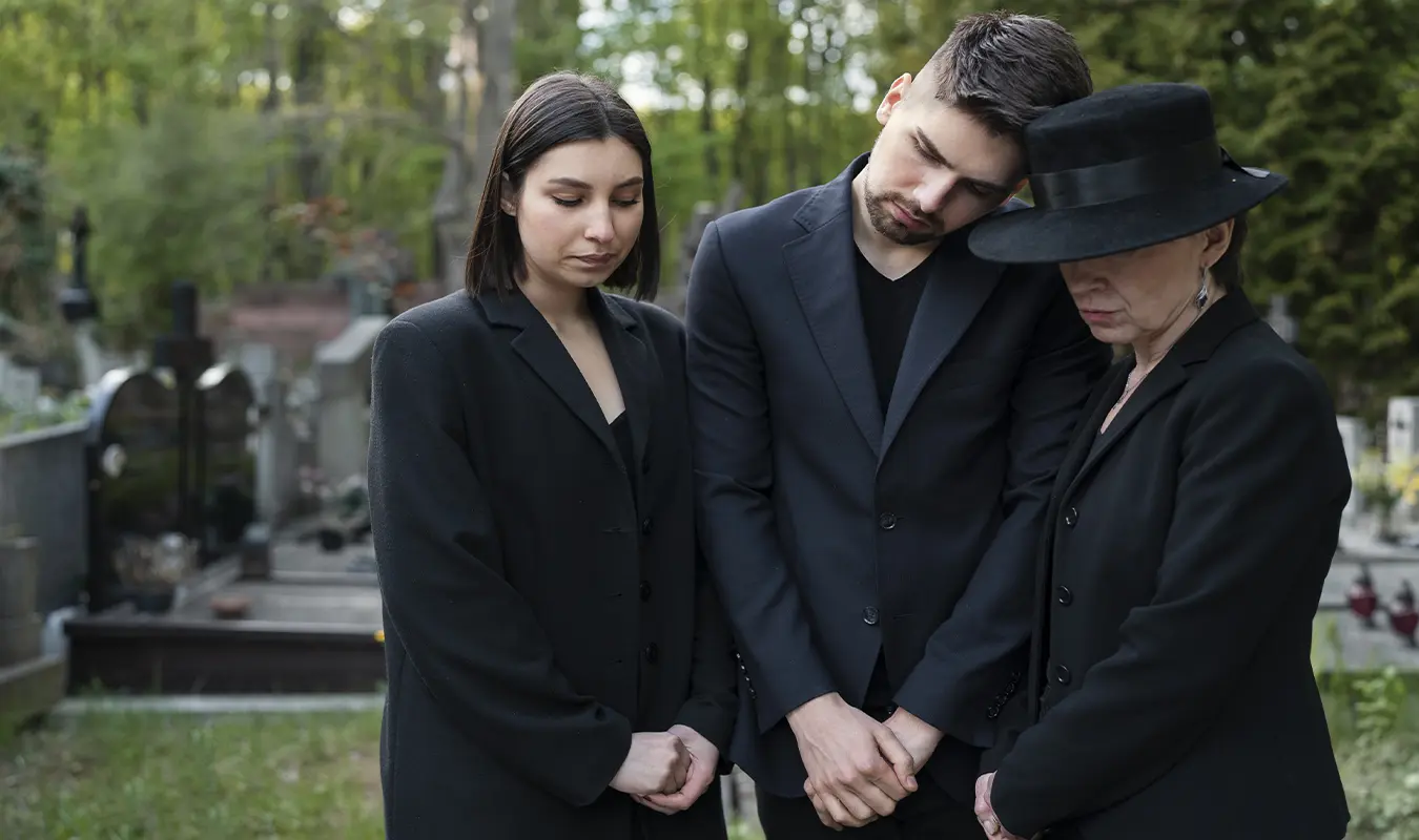 Relatives are hugging and leaning on each other to encourage each other to get through the moment of losing a loved one together.